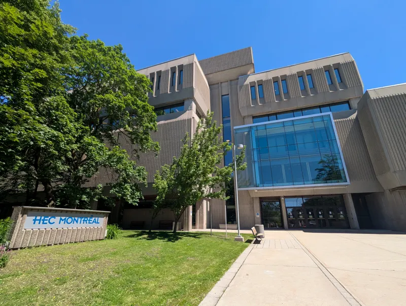 HEC Montréal's Decelles building, with the school's sign in front