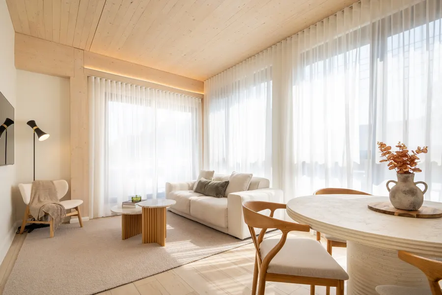 ANDAS living room under an exposed cross-laminated timber ceiling