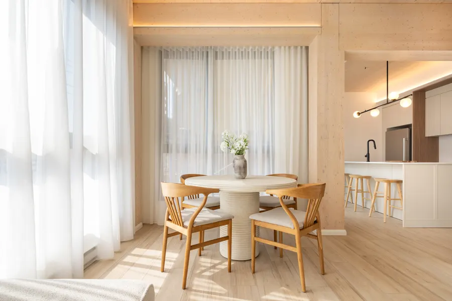 Dining area and kitchen island under the wood ceiling