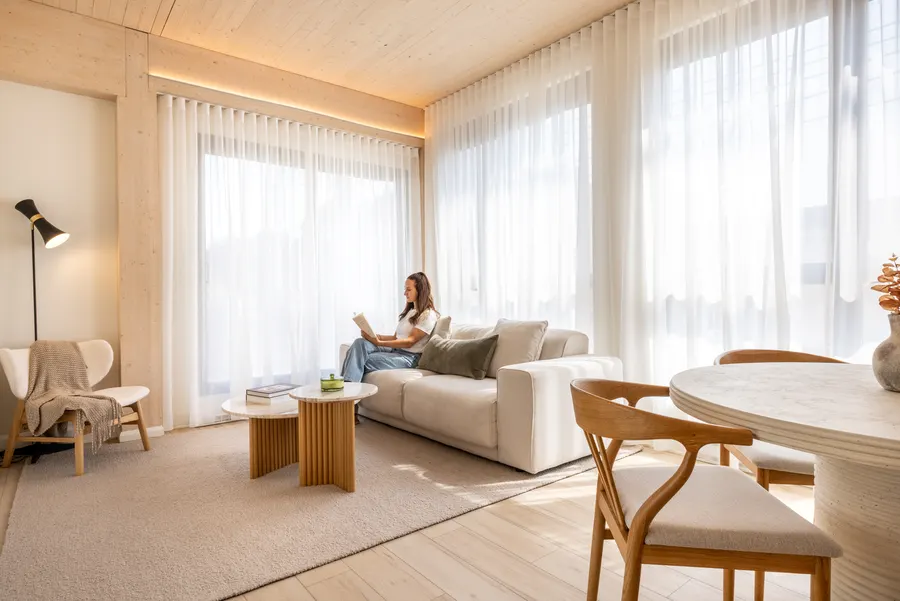 Resident reading in an ANDAS living room