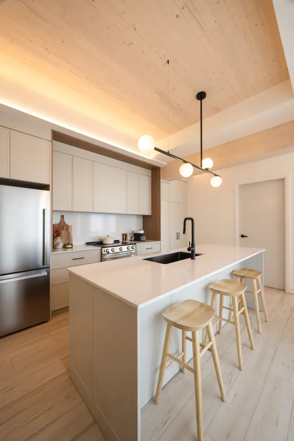 Kitchen and entry hall with exposed wood