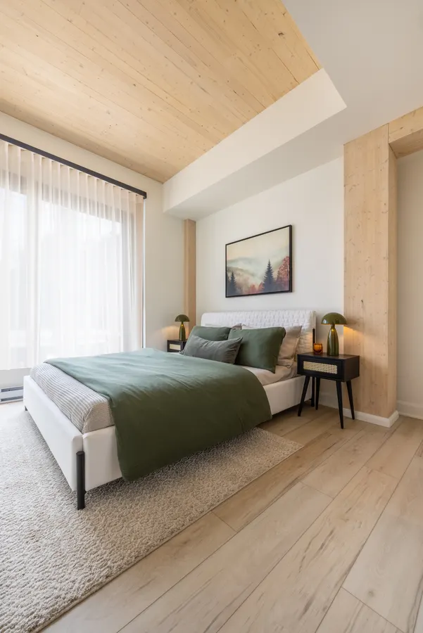 Bedroom with exposed wood ceiling