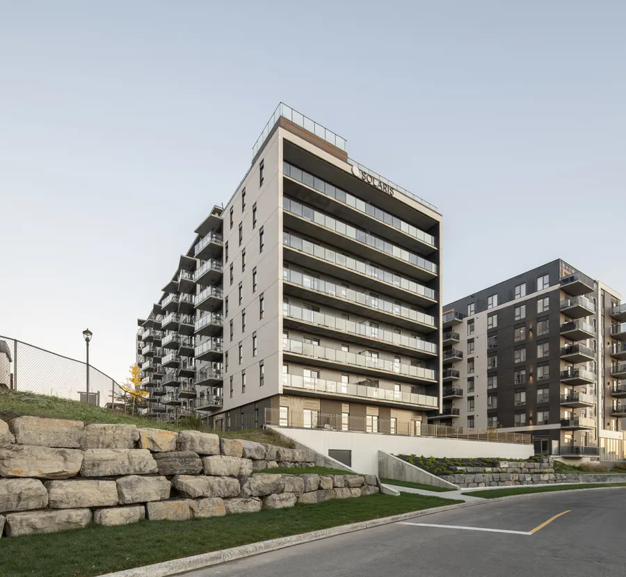 Solaris above a landscaped stone wall