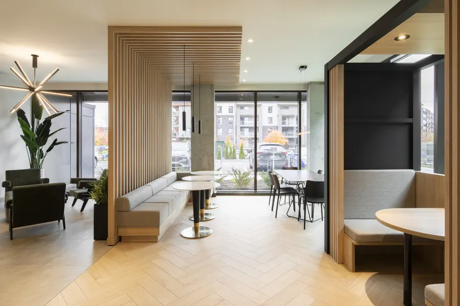Lounge with booth seating and wood slats