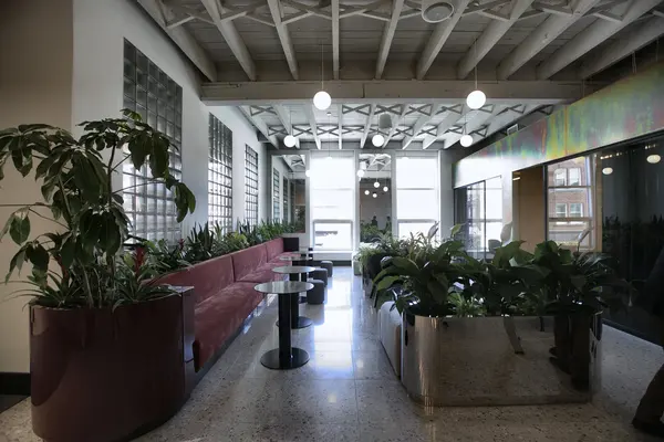 Planters and banquettes running toward the street windows
